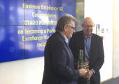 Errol Slyfield CEO Business Excellence NZ presents Otago Polytechnic CEO Phil Ker with the PESA